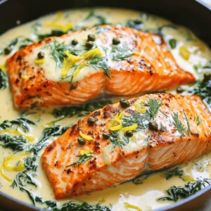 - 4 salmon fillets (approximately 6 oz each, skin on or off) - 1 tablespoon olive oil - Salt and freshly ground black pepper, to taste - 1 small onion, finely chopped - 2 cloves garlic, minced - 1 cup heavy cream (or a creamy alternative) - Zest of 1 lemon - 2 tablespoons fresh lemon juice (about 1 lemon) - 2 tablespoons fresh dill, finely chopped (plus extra for garnish) - 1 teaspoon Dijon mustard - 1 tablespoon capers, rinsed and drained - 1 cup baby spinach (optional, for added nutrition) For this recipe, you need fresh salmon fillets. They are the star of the dish and should be about 6 ounces each. You can keep the skin on or take it off, depending on your taste. Olive oil helps cook the salmon and adds great flavor. You will also need a small onion and two cloves of garlic. These create a lovely base for your sauce. Heavy cream gives the dish its creamy texture. If you want a lighter option, you can use a creamy alternative instead. Lemon zest and juice bring a bright flavor. Fresh dill adds a nice herbal touch. Don't forget the Dijon mustard and capers; they enhance the sauce. Lastly, baby spinach is optional but adds color and nutrition to your meal. Gather these ingredients, and you're ready to make a delicious Creamy Lemon Dill Salmon Skillet! - Heat 1 tablespoon of olive oil in a large skillet over medium-high heat. Wait until the oil shimmers. - While the oil heats, season 4 salmon fillets with salt and pepper on both sides. This adds flavor and enhances the taste. - Once the oil is hot, add the salmon fillets, skin side down if applicable. Cook for 4-5 minutes without moving them. The skin will get crispy, and the fillets will cook halfway. - Carefully flip the salmon and cook for an additional 3-4 minutes. The salmon is done when it reaches 145°F (63°C) internally. Remove the salmon and keep it warm on a plate. - In the same skillet, add 1 small finely chopped onion. Sauté for 2-3 minutes. The onion should become soft and translucent. - Next, add 2 cloves of minced garlic. Cook for an extra minute until the garlic smells fragrant. Avoid browning the garlic to keep the flavor fresh. - Lower the heat to medium. Pour in 1 cup of heavy cream. Then add the zest of 1 lemon, 2 tablespoons of fresh lemon juice, 2 tablespoons of chopped dill, 1 teaspoon of Dijon mustard, and 1 tablespoon of capers. Stir to mix everything well. - Let the sauce simmer for 3-4 minutes. This helps thicken it, which makes it rich and creamy. - If you want to add nutrition, toss in 1 cup of baby spinach. Stir gently until it wilts. This should take about 1-2 minutes. - Return the salmon fillets to the skillet. Spoon the creamy sauce over the top and let it warm for 1 minute. Be careful not to overcook the salmon. - Take the skillet off the heat. For a fresh touch, sprinkle extra dill on top as a garnish. - Serve the salmon hot, alongside your favorite side dishes like rice or pasta to soak up the sauce. Enjoy your meal! To get great salmon, aim for an internal temperature of 145°F (63°C). Use a meat thermometer for accuracy. Cook the salmon until it is opaque and flakes easily with a fork. For crispy skin, start with the skin side down. Don't move it too soon; let it cook for 4-5 minutes before flipping. This helps the skin crisp up nicely. Want to boost flavor? Try adding fresh herbs like parsley or basil. You can also sprinkle in some red pepper flakes for heat. If you want a lighter dish, swap heavy cream for Greek yogurt or coconut cream. These options still give a nice creamy texture. Serve your salmon with sides that complement its flavor. Roasted asparagus or a fresh salad works well. For a filling option, serve it over rice or pasta. To make your dish pop, use a bright plate and add extra dill on top for garnish. This adds both color and a fresh touch to your meal. {{image_4}} You can switch up the salmon for other proteins. Try using white fish like cod or halibut. These fish have a mild taste and cook well in this creamy sauce. If you prefer chicken, use boneless, skinless chicken breasts. Cook them until golden brown and juicy, just like the salmon. If you want a dairy-free dish, you have options. Use coconut cream or cashew cream instead of heavy cream. Both options create a rich texture without dairy. Almond milk or oat milk can also work, but add a little cornstarch to thicken the sauce. You can play with the flavors of this dish easily. Swap lemon for lime or orange for a different twist. Fresh herbs like basil or parsley can add new layers of taste. Each change can bring a fresh feel to your creamy lemon dill salmon skillet. You can store leftover creamy lemon dill salmon in the fridge for up to three days. Make sure to place it in an airtight container. This keeps the salmon fresh and tasty. To reheat the salmon without drying it out, use the stove or microwave. If using the stove, place the salmon in a skillet over low heat. Add a splash of water or broth to keep it moist. Heat for about 5 minutes, flipping gently. In the microwave, cover the salmon with a damp paper towel. Heat for about 30 seconds, then check if it’s warm. Yes, this dish can be frozen. To freeze, let the salmon cool completely. Then, wrap each portion tightly in plastic wrap. Place the wrapped salmon in a freezer bag. It can last up to three months in the freezer. When ready to eat, thaw it in the fridge overnight, then reheat using the tips above. To check if the salmon is done, use a meat thermometer. The internal temperature should reach 145°F (63°C). If you do not have a thermometer, look for these signs: the salmon should be opaque and flake easily with a fork. The flesh should not be raw or translucent. Yes, you can prepare some parts ahead. Cook the salmon and make the sauce separately. Store both in airtight containers in the fridge. When ready to serve, simply reheat each part gently. This keeps the salmon moist and the sauce creamy. This dish pairs well with many sides. Here are some popular options: - Rice or quinoa for a hearty base - Steamed vegetables for freshness - Mashed potatoes for comfort - A light salad for a crisp bite Choose what you enjoy most! Yes, you can make this dish without cream. Use Greek yogurt or coconut milk as a creamy alternative. Both options will still give you that rich texture. Adjust the seasoning as needed to keep the flavor bright and zesty. This dish offers a fun way to cook salmon with cream, lemon, and dill. You learned about ingredients, cooking steps, and some great tips. Always check your salmon's temperature and try different flavors. Remember, whether you choose to switch proteins or try dairy-free options, this recipe stays flexible. Enjoy your creamy lemon dill salmon and impress your friends at the dinner table. Happy cooking!