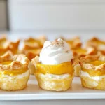 - 1 cup pumpkin puree - 8 oz cream cheese, softened to room temperature - ½ cup granulated sugar - ¼ cup packed brown sugar - 1 teaspoon pure vanilla extract - 1 teaspoon ground cinnamon - ½ teaspoon ground nutmeg - ¼ teaspoon ground ginger - ¼ teaspoon salt - 1 package refrigerated pie crust (or homemade if preferred) - 1 egg, beaten (for egg wash) - Whipped cream and a sprinkle of ground cinnamon for garnish I love using simple, fresh ingredients for these bites. Pumpkin puree brings a warm flavor. Cream cheese gives a rich, creamy texture. Try to buy high-quality cream cheese for the best results. Granulated sugar and brown sugar balance the flavors well. Vanilla extract adds a lovely aroma. The spices—cinnamon, nutmeg, and ginger—make every bite taste like fall. Salt enhances the sweetness, giving the dessert depth. You can use a store-bought pie crust, but making your own is a fun option. A beaten egg wash helps the crust turn golden brown and shiny. Finally, serve these bites with whipped cream and a dash of cinnamon on top. It adds a nice touch to the presentation! 1. In a large bowl, combine 8 oz of softened cream cheese, ½ cup granulated sugar, and ¼ cup brown sugar. 2. Stir in 1 teaspoon of pure vanilla extract and 1 cup of pumpkin puree. 3. Blend this mix until it is smooth and creamy. 4. Next, add 1 teaspoon of ground cinnamon, ½ teaspoon ground nutmeg, ¼ teaspoon ground ginger, and ¼ teaspoon salt. 5. Mix thoroughly until all spices are well blended. Set the filling aside. 1. Roll out the refrigerated pie crust on a floured surface until it’s smooth. 2. Using a cookie cutter or glass, cut out circles that are about 3-4 inches wide. 3. You should get around 24 circles, which is enough for 12 bites. 1. Preheat your air fryer to 330°F (165°C). 2. Take a pie crust circle and place a tablespoon of the filling in the center. 3. Fold the edges of the crust over the filling to make a pocket. 4. Crimp the edges with a fork to seal each bite well. 5. Brush the tops with a beaten egg for a golden finish. 6. Place the bites in a single layer in the air fryer basket. 7. Air fry for 10-12 minutes until golden brown and flaky. 8. Check halfway through to ensure even cooking. 9. Once done, let them cool slightly on a wire rack. 10. Serve warm with whipped cream on top and a sprinkle of cinnamon. To avoid cracks in the crust, use a light touch. Do not stretch the dough too much when cutting and sealing. If you see cracks, gently press them together with your fingers. This helps keep your filling inside. For even cooking in the air fryer, make sure the bites are not touching. Place them in a single layer in the basket. Air needs room to flow around each bite. This helps them cook evenly and turn golden brown. For spice variations, try adding a bit of allspice or cardamom. These spices can add warmth and depth to your bites. You can mix and match to find your perfect flavor. Adding a dash of nutmeg or cloves can elevate the taste. Nutmeg brings a warm, nutty flavor. Cloves add a sweet and slightly spicy kick. Just a pinch goes a long way! Serve your pumpkin pie cheesecake bites with whipped cream on top. This adds a creamy texture that balances the flavor. A dollop of cream also looks nice. For garnishing, sprinkle a little ground cinnamon on top. You can also add a few pecans or walnuts for crunch. This not only makes the bites look pretty but adds a nice touch to the bite. {{image_4}} You can switch pumpkin with sweet potato for a twist. Sweet potato gives a creamy texture and rich taste. It also adds a nice orange color. Try different spices to change the flavor. Instead of cinnamon, use allspice or cardamom for warmth. You can also add a hint of cloves for depth. Each spice brings a new vibe to the bites. For a gluten-free option, look for gluten-free pie crust. Many stores carry these, or you can make your own. Just ensure it is sturdy enough to hold your filling. If you're going vegan, substitute cream cheese with a plant-based option. Look for brands that mimic cream cheese well. This way, everyone can enjoy these tasty bites. Pair your bites with sauces for added flavor. A drizzle of caramel or chocolate can make them extra special. You can also serve them with a side of whipped cream for dipping. These bites work well as a festive appetizer or dessert. They are perfect for holiday gatherings or special occasions. Just place them on a nice platter, and watch them disappear! To store your pumpkin pie cheesecake bites, let them cool completely first. Place them in an airtight container. This keeps them fresh and tasty. You should enjoy them within 3 to 5 days. If you want to keep them longer, freezing is a better option. For freezing, wrap each bite in plastic wrap. Then place them in a freezer-safe bag or container. This will help prevent freezer burn. You can freeze them for up to 3 months. When you're ready to eat, take them out and let them thaw in the fridge. To reheat, air fry them at 330°F for about 5 to 7 minutes. This keeps them crispy and delicious. Before serving, reheat the bites if you stored them in the fridge or freezer. Warm bites taste best. You can serve them with a dollop of whipped cream and a sprinkle of cinnamon. This adds a nice touch and makes them look pretty. Enjoy them as a sweet treat anytime! Yes, you can use homemade pie crust. Making your own crust gives you control over the flavor and texture. A homemade crust can taste fresher and more flaky than store-bought options. To get the best texture, use cold butter in your dough. This helps create a flaky crust. Chill the dough before rolling it out, and avoid overworking it. This keeps the crust tender. You can prep these bites ahead. Make the filling and store it in the fridge for up to three days. Roll out and cut the pie crust ahead of time too. For storage, keep the bites in an airtight container. If you freeze them, place parchment paper between layers. This prevents sticking. To reheat, place them in a preheated air fryer at 330°F for 5-7 minutes. This will keep them crispy. I recommend serving these bites warm. They taste best when fresh out of the air fryer. You can add whipped cream on top for extra flavor. Pair them with a sprinkle of ground cinnamon for a nice touch. These bites also go well with caramel sauce. Enjoy them as a dessert or a fun snack! These pumpkin cheesecake bites are easy and fun to make. We covered the ingredients needed, how to prepare the filling and crust, and tips for perfecting your bites. You can try different flavors and dietary options too. With proper storage, they stay tasty for days. Enjoy experimenting and making these delights for any gathering. Your friends and family will love them. Happy cooking, and may your kitchen be filled with delicious aromas!