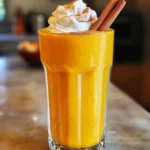 To make a tasty pumpkin pie smoothie, you need these ingredients: - 1 cup pumpkin puree (canned or fresh) - 1 banana (frozen is best) - 1 cup almond milk (or any milk you like) - ½ teaspoon pure vanilla extract - 1 teaspoon pumpkin pie spice - 1 tablespoon maple syrup (sweeten to taste) - ¼ cup Greek yogurt (for creaminess, optional) - Ice cubes (for thickness, optional) You can adjust the measurements based on your taste. If you want it sweeter, add more maple syrup. For a thicker smoothie, use more ice or yogurt. You can swap almond milk with any milk, like oat or cow's milk. If you do not have pumpkin pie spice, mix cinnamon and nutmeg for a similar taste. For an even richer flavor, consider adding: - A scoop of nut butter, like almond or peanut - A sprinkle of chia seeds for extra nutrients - A dash of honey for natural sweetness These additions can make your smoothie even more delicious and filling. Enjoy experimenting! To make your pumpkin pie smoothie, start by gathering your ingredients. You will need pumpkin puree, a frozen banana, almond milk, vanilla extract, pumpkin pie spice, maple syrup, and Greek yogurt if you want extra creaminess. This setup helps you blend smoothly. Next, pour the pumpkin puree into your blender. Add the frozen banana, almond milk, vanilla extract, pumpkin pie spice, and maple syrup. If you like a richer taste, toss in Greek yogurt. When you blend, use a high setting. Blend until your mixture is smooth and creamy. If you want it thicker, add a few ice cubes. Blend again until you reach the texture you want. Don't forget to taste your smoothie. If you want more sweetness, add more maple syrup. Blend briefly to mix it well. Pour your smoothie into a tall glass for a nice look. For the best experience, drink it right away. You can garnish with a sprinkle of cinnamon or a dollop of whipped cream. For fun, place a cinnamon stick in the glass. This adds a nice touch and a lovely scent. Enjoy your tasty treat! One common mistake is using fresh pumpkin instead of pumpkin puree. Fresh pumpkin needs more cooking and blending. It can make your smoothie grainy. Another mistake is skipping the frozen banana. A frozen banana gives a creamier texture. If you use a fresh banana, your smoothie may be too thin. To adjust sweetness, start with one tablespoon of maple syrup. Blend it in, then taste. If it needs more sweetness, add more maple syrup, a little at a time. You can also use honey or agave syrup. These sweeteners can enhance the flavor, too. To make your smoothie creamier, use Greek yogurt. It adds richness without overpowering the pumpkin flavor. If you want a vegan option, use coconut yogurt. You can also add more almond milk. Just be careful not to add too much, as it can thin out your smoothie. For an extra touch, try a splash of heavy cream if you're not worried about calories. {{image_4}} You can easily make this smoothie dairy-free and vegan. Just skip the Greek yogurt. Almond milk works great, but you can use coconut or oat milk too. These options keep your drink creamy and delicious. Adjust the maple syrup to suit your taste. This way, you enjoy the same great flavor without any dairy. You can also switch up the spices in your smoothie. Instead of pumpkin pie spice, try adding nutmeg or ginger. These spices add a warm and cozy feel. You can mix cinnamon with allspice for a new twist. Each season brings different flavors. Get creative and find your favorite spice blend! To turn your smoothie into a meal replacement, add extra protein. You can include a scoop of protein powder or nut butter. This helps keep you full longer. You might also add oats for more fiber. A tablespoon of chia seeds can boost nutrition too. With these changes, your smoothie becomes a tasty and filling meal. If you have leftover pumpkin pie smoothie, store it in the fridge. Use an airtight container to keep it fresh. It will stay good for up to two days. Before you drink it, give it a good shake or stir. This helps mix any settled ingredients. You can freeze your pumpkin pie smoothie for later. Pour it into ice cube trays or a freezer-safe container. This way, you can make smoothie pops. When you want a quick drink, take out the cubes. Blend them with a little milk for a fresh treat. The frozen version can last up to three months. To refresh a stored smoothie, add a splash of milk. This helps restore its creamy texture. If it feels too thick, blend it again. For a warm drink, heat it gently in a pot. Avoid boiling it. Warm it to your liking and enjoy a cozy version of your pumpkin pie smoothie! You can use any milk you like. Soy milk, oat milk, or coconut milk work great. Each option brings a unique flavor. If you want to skip milk, use water or juice. This smoothie will still taste good and be smooth. The pumpkin pie smoothie stays fresh for about one day in the fridge. Store it in a sealed jar. If it separates, just shake it before drinking. However, I recommend drinking it right away for the best taste and texture. Smoothies are best when they are fresh! Yes, you can add protein powder easily! It makes the smoothie more filling. Choose a flavor that you like. Vanilla or unflavored protein works best here. Just add one scoop to your mix before blending, and enjoy a nutritious boost! This post covered key elements of making a great smoothie. We explored ingredients, measurements, and options for richness. I shared step-by-step methods, blending tips, and serving ideas to enhance enjoyment. You learned how to avoid mistakes and customize sweetness. We even dove into dairy-free options and variations like using seasonal spices. Finally, I shared best practices for storing leftovers and answered common questions. Enjoy crafting your perfect smoothie! You now have the tools to make it truly special.