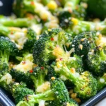 - 1 pound fresh broccoli florets - 3 tablespoons extra virgin olive oil - 4 cloves garlic, finely minced - ½ cup freshly grated Parmesan cheese - Optional: ¼ teaspoon red pepper flakes - Seasoning: sea salt and freshly cracked black pepper - Zest and juice of lemon for added flavor Garlic Parmesan Roasted Broccoli is a simple dish that shines with fresh ingredients. Start with one pound of broccoli florets. Look for bright green, firm florets for the best taste. Next, grab three tablespoons of extra virgin olive oil. This oil adds richness and helps the broccoli roast well. Then, you’ll need four cloves of garlic, minced finely. Garlic gives a strong, savory flavor that pairs perfectly with broccoli. For a cheesy touch, use half a cup of freshly grated Parmesan cheese. This cheese adds a creamy texture and rich taste. If you like a bit of heat, add a quarter teaspoon of red pepper flakes. This step is optional but can give your dish a nice kick. Don't forget to season with sea salt and freshly cracked black pepper. These spices bring out the flavors of your ingredients. Finally, the zest and juice of one lemon will brighten the dish. The lemon adds a fresh, zesty flavor that lifts the roasted broccoli. Each ingredient plays an important role in making this side dish a hit. 1. Preheat the oven to 425°F (220°C). This heat gives the broccoli crispy edges. 2. In a large mixing bowl, add 1 pound of fresh broccoli florets. This will be the star of your dish. 1. Pour in 3 tablespoons of extra virgin olive oil. Toss the broccoli to coat it well. 2. Add 4 cloves of finely minced garlic. This will add rich flavor. 3. Sprinkle in ½ cup of freshly grated Parmesan cheese. This makes everything cheesy and delicious. 4. If you want a spicy kick, add ¼ teaspoon of red pepper flakes. 5. Season with sea salt and freshly cracked black pepper to taste. Toss everything together well. 1. Spread the seasoned broccoli evenly on a lined baking sheet. Keep the florets in a single layer. 2. Roast in the oven for 20-25 minutes. Stir halfway through to ensure even cooking. You want fork-tender broccoli with browned edges. This method makes a simple yet flavorful side dish that pairs with many meals. To get crispy edges, spread the broccoli in a single layer on your baking sheet. This allows hot air to circulate around each floret. When the broccoli is crowded, it will steam instead of roast. Also, roast at a high temperature, like 425°F (220°C). Heat helps the broccoli brown and become crispy. After roasting, add lemon zest and juice. This brightens the taste and adds freshness. You can also try different cheeses, like pecorino or feta. Adding spices, like smoked paprika or cumin, can change the flavor too. Feel free to experiment and find your favorite mix! {{image_4}} You can change things up with different vegetables. Asparagus and Brussels sprouts are great options. They roast well and soak up flavors just like broccoli. You can also try cauliflower for a unique twist. If you want to switch cheeses, try pecorino. It has a sharp taste that pairs nicely with garlic. For a vegan option, use nutritional yeast. It gives a cheesy flavor without dairy. Garlic Parmesan roasted broccoli pairs well with many main dishes. Grilled chicken or fish complement its flavors nicely. You can serve it next to steak for a hearty meal, too. This dish also works well as a snack. Enjoy it hot or cold. You can dip it in your favorite sauce. Serve it with hummus or ranch for a tasty treat. To keep your Garlic Parmesan Roasted Broccoli fresh, store it in the fridge. Let it cool completely first. Then, place it in an airtight container. This helps keep moisture out. You can store it for up to three days. If you want to keep it longer, freeze it. Use a freezer-safe bag and squeeze out the air before sealing. When you reheat the broccoli, aim to keep it crispy. The best method is to use the oven. Preheat your oven to 350°F (175°C). Spread the broccoli on a baking sheet. Heat for about 10 minutes. This will restore some crunch. To refresh the flavors, add a splash of lemon juice before serving. You could also sprinkle a bit of new Parmesan cheese on top. This revives the taste and makes it tasty again. Can I make this recipe ahead of time? Yes, you can prep the broccoli ahead of time. Toss it with oil and seasonings. Store it in the fridge for up to 24 hours. When ready, just roast it for a fresh side dish. How can I make it spicier? To add heat, increase the red pepper flakes. You can also mix in some cayenne pepper or a dash of hot sauce. Adjust the spice to fit your taste. What is a good vegetarian main dish to pair with this side? Garlic Parmesan roasted broccoli goes great with quinoa or a hearty vegetable risotto. Grilled portobello mushrooms also make a tasty main dish. They complement the broccoli’s rich flavor well. Can I use frozen broccoli instead of fresh? You can use frozen broccoli, but fresh tastes better. If you use frozen, thaw and drain it first. Pat it dry to avoid sogginess. Adjust roasting time since frozen broccoli may cook faster. This post shared how to make Garlic Parmesan Roasted Broccoli. You learned about fresh ingredients and step-by-step instructions for roasting. Tips included how to get crispy edges and flavor boosts. I also suggested tasty variations and storage methods to keep leftovers fresh. Enjoy trying this easy recipe! Remember, using fresh ingredients and the right techniques makes all the difference. A healthy side can elevate any meal. Happy cooking!