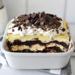 - Oreo cookies: 1 package (about 36 cookies), finely crushed - Unsalted butter: ½ cup, melted - Cream cheese: 8 oz, softened to room temperature - Powdered sugar: 1 cup - Whipped topping: 1 cup (like Cool Whip) - Instant chocolate pudding mix: 1 package (3.9 oz) - Cold milk: 2 cups - Additional whipped topping: 1 cup (for the final layer) - Garnish: Chocolate shavings or crushed Oreo cookies For the best flavor, use fresh cream cheese and high-quality whipped topping. If you want a fun twist, you can swap Oreo cookies for another chocolate cookie. This adds a unique taste while keeping it delicious. {{ingredient_image_2}} To start, grab a medium mixing bowl. Add 36 crushed Oreo cookies and ½ cup melted butter. Stir this mix until the crumbs are well-coated. Now, take your 9x13 inch baking dish and press the mixture firmly into the bottom. Make sure it’s even. This helps the crust hold together. You can use a flat-bottomed cup to pack it down. Once done, place the dish in the fridge. Let it chill while you prepare the next layers. Next, in a separate bowl, take 8 oz of softened cream cheese and 1 cup of powdered sugar. Beat them together using an electric mixer. Mix on medium speed until it’s creamy and smooth. Avoid over-mixing to keep it fluffy. Now, gently fold in 1 cup of whipped topping with a spatula. Be careful not to deflate the mix. Spread this cream cheese layer evenly on the chilled crust. This layer adds a rich, creamy taste. In another bowl, whisk together 1 package of instant chocolate pudding mix with 2 cups of cold milk. Whisk for 2-3 minutes until it thickens. This is key for a perfect pudding layer. Pour the thickened pudding over the cream cheese layer. Use a spatula to spread it evenly. This ensures every bite has that delightful chocolate flavor. Now, take the remaining 1 cup of whipped topping. Carefully spread it over the chocolate pudding layer. Use a spatula to smooth the top. A smooth finish looks great and makes serving easier. This layer adds a light, airy touch to your dessert. Cover your lasagna with plastic wrap and refrigerate for at least 4 hours. For the best flavor, chill it overnight. This helps the layers set properly. Before serving, add some fun garnishes! Sprinkle chocolate shavings or crushed Oreo cookies on top. This not only looks nice but adds a tasty crunch to the dessert. To make your Chocolate Oreo Lasagna look stunning, layering is key. Start with the crust. Press it evenly into the pan. This gives a solid base. Next, spread the cream cheese layer smoothly over it. Use a spatula for a nice finish. The pudding layer comes next. Pour it gently to keep layers separate. Finally, top it with whipped topping. Smooth it out for a clean look. To avoid sogginess, chill the crust before adding layers. A cold crust holds up better. Let the layers set well in the fridge. This helps them stay distinct when you cut the dessert. Use a sharp knife for clean slices. Chocolate Oreo Lasagna pairs well with coffee or milk. A scoop of vanilla ice cream adds a tasty touch. You can also serve it with fresh berries for a fruity contrast. For a fun twist, serve it in individual cups. Layer the ingredients in clear cups for a beautiful view. This makes it easy for guests to grab and enjoy. You could even use mini jars for a cute presentation. Encourage everyone to dig in and enjoy all the layers together. Pro Tips Chill for Best Results: Allow the lasagna to chill overnight for the flavors to meld and the texture to firm up, making it easier to cut into clean squares. Variations on Toppings: Experiment with different toppings such as crushed nuts, sprinkles, or even a drizzle of caramel sauce for added flavor and visual appeal. Use Quality Ingredients: For the best flavor, use high-quality cocoa powder and chocolate pudding mix. The better the ingredients, the better your dessert will taste. Serve with Ice Cream: Elevate your dessert by serving individual squares of chocolate lasagna with a scoop of vanilla ice cream or whipped cream on the side. {{image_4}} You can easily switch up the flavors in your Chocolate Oreo Lasagna. Here are some fun ideas: - Peanut Butter: Mix peanut butter into the cream cheese layer. This adds a rich, nutty taste. - Mint: Use mint-flavored Oreos for a fresh twist. You can also add mint extract to the cream cheese layer. - Coffee: Add instant coffee granules to the chocolate pudding for a tasty kick. For ingredient swaps, try different cookies. Use gluten-free cookies if you want a gluten-free option. You can also use flavored whipped toppings. This way, you can create your own signature lasagna. If you need a gluten-free version, look for gluten-free Oreo cookies. Many brands offer great alternatives. Just follow the same steps in the recipe. For a dairy-free option, choose dairy-free cream cheese and whipped topping. You can also use almond milk or oat milk for the pudding layer. These swaps let everyone enjoy this dessert without worry. To keep your Chocolate Oreo Lasagna fresh, refrigerate it promptly. Place it in an airtight container or cover it tightly with plastic wrap. This helps keep the layers intact and prevents drying out. If you plan to eat it later, you can freeze it. To freeze, cut the lasagna into squares. Wrap each piece in plastic wrap and place them in a freezer-safe bag. This method allows for easy thawing later. The lasagna stays fresh in the fridge for about 3 to 5 days. After that, the layers may start to lose their texture. If you freeze the lasagna, it can last up to 2 months. Always check for signs of spoilage before eating. If you notice any off smells, a change in color, or an unusual texture, it’s best to throw it away. Enjoying this dessert while it's fresh ensures you savor every layer of yum! Chocolate Oreo Lasagna is a layered dessert. It has a crust made of crushed Oreo cookies. The crust holds a creamy layer of cream cheese mixed with whipped topping. Then comes a rich layer of chocolate pudding. Finally, more whipped topping tops it all off. You can garnish it with chocolate shavings or crushed Oreos. This dessert is both tasty and fun to serve as a treat. Yes, you can make this dessert ahead of time! It needs at least four hours in the fridge to set. For best results, chill it overnight. This gives the layers time to blend. You can impress guests by making it a day earlier. Just keep it covered in the fridge until you are ready to serve. Yes, you can create a vegan chocolate lasagna! Use vegan Oreo cookies for the crust. For the cream cheese layer, swap regular cream cheese for a dairy-free version. You can use coconut cream or a vegan whipped topping. For the pudding, make sure to use a vegan chocolate pudding mix. This way, everyone can enjoy the dessert. Scaling this recipe is simple. If you want more servings, double the ingredients. Use a larger baking dish if needed. For fewer servings, halve the ingredients and use a smaller dish. Keep the ratios the same for each layer. This way, you will still have a delicious treat no matter the size! To sum up, we covered how to make a tasty Chocolate Oreo Lasagna. We looked at the key ingredients and their quality, then followed step-by-step instructions for each layer. I shared tips for beautiful layers and how to elevate your presentation. Don't forget the variations and storage tips to keep your dessert fresh. With what you learned, you can impress anyone with this treat. Enjoy making and sharing this delicious dessert!