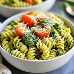 To make One Pot Creamy Pesto Pasta, gather these simple ingredients: - 12 oz (340g) pasta of your choice (fusilli, penne, or farfalle work well) - 1 cup of your favorite pesto (homemade or store-bought) - 1 cup heavy cream - 2 cups vegetable broth (low-sodium is best) - 1 cup cherry tomatoes, halved - 1 cup fresh spinach leaves, roughly chopped - ½ cup grated Parmesan cheese (plus more for serving) - 2 tablespoons olive oil - 3 cloves garlic, minced - Salt and pepper, to taste - Red pepper flakes (optional) You can easily swap some ingredients based on what you have: - Use whole wheat or gluten-free pasta for a healthier option. - Swap heavy cream with half-and-half for a lighter dish. - Try different cheeses, like feta or goat cheese, for unique flavors. - Replace cherry tomatoes with sun-dried tomatoes for a tangy twist. - Use vegetable or chicken broth to add depth to the flavor. Using fresh ingredients makes a big difference. Fresh spinach adds vibrant color and nutrients. Fresh garlic gives a strong, rich flavor. Ripe cherry tomatoes bring sweetness to the dish. Always choose high-quality pesto, as it is the base of your sauce. Fresh ingredients not only enhance taste but also make the meal more enjoyable. They provide better texture and aroma, making your cooking experience delightful. Plus, they help you connect with the food you create, making each bite even more special. {{ingredient_image_2}} Start by heating two tablespoons of olive oil in a large pot over medium heat. Add three minced garlic cloves and sauté them for about one minute. Watch closely; you want the garlic fragrant, not burnt. This step builds a strong flavor base for your dish. Now, pour in two cups of vegetable broth. Bring this mixture to a gentle boil. The broth will infuse the pasta with rich flavor. Once boiling, add 12 ounces of your chosen pasta, like fusilli or penne. Cook according to the package instructions, stirring often. This usually takes about eight to twelve minutes until the pasta is al dente. After the pasta is cooked, reduce the heat to low. Stir in one cup of heavy cream and one cup of your favorite pesto. Mix well until every piece of pasta is coated in this creamy goodness. The sauce will become rich and velvety, perfect for your dish. Next, toss in one cup of halved cherry tomatoes and one cup of roughly chopped fresh spinach. Cook for an extra two to three minutes. This will let the spinach wilt and the tomatoes soften. Finally, mix in half a cup of grated Parmesan cheese. Season with salt and pepper to taste. If you like a bit of heat, add red pepper flakes. For a finishing touch, serve hot with extra Parmesan and, if you wish, fresh basil leaves. Enjoy your delightful one pot creamy pesto pasta! To get the best pasta texture, cook it in vegetable broth. This gives it extra flavor. Always check the package for cooking times. Stir often to prevent sticking. Aim for al dente, which means firm but tender. This will keep the pasta from getting mushy. If you want a bit more bite, reduce the cooking time by a minute. Making pesto at home is easy and fun. You need fresh basil, garlic, pine nuts, Parmesan cheese, and olive oil. Blend these ingredients until smooth. You can adjust the flavors to fit your taste. For a twist, try adding nuts like walnuts or almonds. Homemade pesto is fresher and tastier than store-bought. Plus, you can control the amount of oil and salt. If you want your dish creamier, add more heavy cream. Start with a splash and mix well. Keep checking the texture. If it seems too thick, add a bit more vegetable broth. For a lighter version, try using half-and-half instead of cream. This keeps the flavor while making it less rich. Adjusting creaminess is all about your personal taste! Pro Tips Choose the Right Pasta: Opt for pasta shapes like fusilli or farfalle that hold sauce well, enhancing each bite. Adjust Creaminess: If you prefer a lighter dish, reduce the amount of heavy cream or use half-and-half for a healthier option. Customize Your Veggies: Feel free to add other vegetables such as bell peppers or zucchini to boost nutrition and flavor. Add a Zesty Kick: Incorporate a squeeze of fresh lemon juice just before serving for a bright contrast to the creamy sauce. {{image_4}} You can use many pasta shapes for this dish. Fusilli, penne, and farfalle all work well. These shapes hold the creamy sauce nicely. You can also try spaghetti for a classic look. Or use shells for fun bites. Each shape adds a unique twist to your meal. Choose what you like best! Want to make your pasta more filling? Add proteins like chicken or shrimp. Cook the protein in the pot before adding garlic. This adds flavor and makes the dish more satisfying. You can also use cooked sausage or tofu for a quick fix. Just toss them in with the pasta to heat through. If you want a vegetarian version, just skip the meat. Use vegetable broth to keep it light. For a vegan option, switch heavy cream for coconut milk or cashew cream. These swaps keep the dish creamy and delicious. Make sure your pesto is dairy-free too! After you finish your meal, let the pasta cool down a bit. Place leftovers in an airtight container. This helps keep it fresh and tasty. Store it in the fridge if you plan to eat it within three days. Make sure to label the container with the date. This way, you won't forget when it was made. When you're ready to eat leftovers, use the stovetop for the best taste. Place the pasta in a pan over low heat. Add a splash of vegetable broth or cream to help it warm up. Stir gently until heated through. If you use the microwave, cover the dish with a lid. Heat in short bursts, stirring in between to prevent hot spots. You can freeze this pasta if you want to save it for later. Use a freezer-safe container or a resealable bag. Make sure to remove as much air as you can. This helps prevent freezer burn. Label the bag with the date. The pasta can stay good for up to three months. When you're ready to eat, thaw it in the fridge overnight. Reheat as mentioned above for the best results. Yes, you can! To make this dish gluten-free, simply choose gluten-free pasta. Many options are available, like rice or chickpea pasta. Check the package for cooking times, as they may differ from regular pasta. To adjust the spice level, you can add or reduce red pepper flakes. If you want more heat, use more flakes. For less heat, skip them entirely. You can also add a touch of black pepper for a mild kick. If you want a lighter option, try using half-and-half or whole milk. For a dairy-free choice, coconut milk or a cashew cream can work well. These swaps will change the flavor slightly but still create a creamy sauce. This blog post covered how to make a delicious pasta dish. We talked about fresh ingredients, prep steps, and tips for flavor. You can choose different pasta shapes or add proteins like chicken. Proper storage and reheating keep leftovers tasty. Remember, adjusting creaminess or spice can fit your taste. I hope you feel ready to try this recipe and make it your own. Happy cooking!