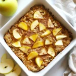 To make the warm and cozy apple cinnamon baked oatmeal, gather these simple ingredients: - 2 cups rolled oats - 2 cups almond milk (or your preferred milk) - 2 large apples, peeled and chopped - ½ cup brown sugar (or maple syrup) - ¼ cup unsweetened applesauce - 1 teaspoon baking powder - 1 teaspoon ground cinnamon - ½ teaspoon vanilla extract - ¼ teaspoon salt - Optional ingredients: ½ cup chopped nuts, ¼ cup raisins or dried cranberries These ingredients create a smooth and hearty dish. The apples provide natural sweetness and texture. The oats give it that warm, comforting feel. Enjoy the simple process of mixing and baking. You will love how the aroma fills your kitchen as it bakes. {{ingredient_image_2}} - Preheat your oven to 350°F (175°C). - Lightly grease a 9x9-inch baking dish. - In a large bowl, mix 2 cups rolled oats, 1 teaspoon baking powder, 1 teaspoon ground cinnamon, and ¼ teaspoon salt. - In another bowl, whisk together 2 cups almond milk, ½ cup brown sugar or maple syrup, ¼ cup unsweetened applesauce, and ½ teaspoon vanilla extract. - Pour the wet mixture into the bowl of dry ingredients. - Stir gently until just combined. - Fold in 2 large chopped apples. - If you want, add ½ cup chopped nuts and ¼ cup raisins or dried cranberries. - Pour the mixture into the greased baking dish. - Bake for 30-35 minutes. Check if the top is golden brown. - Once done, take it out and cool for 5 minutes. - Slice into squares and serve warm. Enjoy! - Tips for measuring ingredients: Always use the correct tools. A dry measuring cup works best for oats and sugar. For liquids, use a liquid measuring cup. This step keeps your recipe accurate and tasty. - Avoiding overmixing for the best texture: Mix just until the wet and dry ingredients combine. Overmixing can make your oatmeal dense. You want a light and fluffy texture, so be gentle when you stir. - Suggested spices or flavor boosters: Add a pinch of nutmeg or ginger for warmth. You can also try a splash of maple extract or a sprinkle of cardamom for a twist. These spices will enhance the cozy flavors of apple and cinnamon. - Swaps for dietary preferences: To make this dish vegan, use almond milk and maple syrup instead of brown sugar. For a gluten-free option, ensure your oats are certified gluten-free. Both swaps keep the dish tasty and friendly for all diets. These tips will help you create the best Apple Cinnamon Baked Oatmeal that is both delicious and comforting. Enjoy the warm, cozy flavors! Pro Tips Use Fresh Apples: Opt for a mix of sweet and tart apples, such as Granny Smith and Honeycrisp, for a balanced flavor in your baked oatmeal. Customize Sweetness: Adjust the sweetness by using less brown sugar or maple syrup, especially if you plan to add sweet toppings like honey or syrup when serving. Make-Ahead Option: Prepare the mixture the night before and refrigerate. In the morning, simply bake it for a quick and convenient breakfast. Texture Variations: For a creamier texture, increase the almond milk slightly or add a dollop of Greek yogurt on top when serving. {{image_4}} You can change up the flavors in your baked oatmeal. Here are two fun ideas: - Berry cinnamon baked oatmeal: Swap out the apples for mixed berries. Use blueberries, strawberries, or raspberries. They add a juicy burst and a sweet taste. - Nut butter versions: Add a scoop of peanut or almond butter to the wet mix. This gives a rich, nutty flavor that pairs well with apples. It also boosts the protein in your dish. You can easily switch out some ingredients to make it your own. Here are some options: - Using different types of sweeteners: If you prefer, you can use honey or agave syrup instead of brown sugar. This gives you flexibility based on what you have at home. - Mixing in other fruits or dried goods: Feel free to use bananas, pears, or dried apricots. These add different tastes and textures. You can also try nuts like almonds or cashews for crunch, or add in some coconut flakes for a tropical twist. To keep your Apple Cinnamon Baked Oatmeal fresh, let it cool completely. Then, place it in an airtight container. This way, it stays moist and tasty. You can store it in the fridge for up to five days. If you want to enjoy it later, consider freezing portions. When it's time to enjoy your oatmeal again, reheating is easy. The best method is to use the microwave. Place a slice on a plate and cover it with a damp paper towel. Heat it for about 30 seconds to 1 minute. If you prefer the oven, preheat it to 350°F (175°C) and warm the oatmeal for about 10-15 minutes. Enjoy it warm for that cozy feel! Can I use quick oats instead of rolled oats? Yes, you can use quick oats. They will cook faster and change the texture. Rolled oats give a chewier bite, which I prefer. How do I make this recipe ahead of time? You can prepare the mixture the night before. Store it in the fridge, then bake it in the morning. This saves time and makes breakfast easy. What can I serve with apple cinnamon baked oatmeal? Serve it with yogurt or a splash of milk. You can also add fresh fruit on top. A drizzle of honey or maple syrup adds sweetness. How can I make this dish more nutritious? Add seeds like chia or flaxseed for extra fiber. You can also swap brown sugar for mashed banana or applesauce. This boosts nutrition without losing flavor. Is it freezer-friendly? Yes, this dish freezes well. Cut it into squares and wrap them tightly. Store in an airtight container for up to three months. Can I make it without nuts? Absolutely! You can leave out the nuts or replace them with seeds. This keeps the dish nut-free while still being delicious. In this blog post, we explored how to make a delicious apple cinnamon baked oatmeal. You learned about the simple ingredients needed and the easy steps to follow. We shared tips to perfect your dish and offered tasty variations. Remember, you can always store leftovers for later and tweak the recipe to fit your needs. Enjoy this warm, satisfying meal as a healthy start to your day or a cozy snack. Embrace your cooking journey and have fun trying out different flavors. Happy baking!