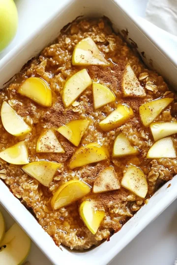 To make the warm and cozy apple cinnamon baked oatmeal, gather these simple ingredients: - 2 cups rolled oats - 2 cups almond milk (or your preferred milk) - 2 large apples, peeled and chopped - ½ cup brown sugar (or maple syrup) - ¼ cup unsweetened applesauce - 1 teaspoon baking powder - 1 teaspoon ground cinnamon - ½ teaspoon vanilla extract - ¼ teaspoon salt - Optional ingredients: ½ cup chopped nuts, ¼ cup raisins or dried cranberries These ingredients create a smooth and hearty dish. The apples provide natural sweetness and texture. The oats give it that warm, comforting feel. Enjoy the simple process of mixing and baking. You will love how the aroma fills your kitchen as it bakes. {{ingredient_image_2}} - Preheat your oven to 350°F (175°C). - Lightly grease a 9x9-inch baking dish. - In a large bowl, mix 2 cups rolled oats, 1 teaspoon baking powder, 1 teaspoon ground cinnamon, and ¼ teaspoon salt. - In another bowl, whisk together 2 cups almond milk, ½ cup brown sugar or maple syrup, ¼ cup unsweetened applesauce, and ½ teaspoon vanilla extract. - Pour the wet mixture into the bowl of dry ingredients. - Stir gently until just combined. - Fold in 2 large chopped apples. - If you want, add ½ cup chopped nuts and ¼ cup raisins or dried cranberries. - Pour the mixture into the greased baking dish. - Bake for 30-35 minutes. Check if the top is golden brown. - Once done, take it out and cool for 5 minutes. - Slice into squares and serve warm. Enjoy! - Tips for measuring ingredients: Always use the correct tools. A dry measuring cup works best for oats and sugar. For liquids, use a liquid measuring cup. This step keeps your recipe accurate and tasty. - Avoiding overmixing for the best texture: Mix just until the wet and dry ingredients combine. Overmixing can make your oatmeal dense. You want a light and fluffy texture, so be gentle when you stir. - Suggested spices or flavor boosters: Add a pinch of nutmeg or ginger for warmth. You can also try a splash of maple extract or a sprinkle of cardamom for a twist. These spices will enhance the cozy flavors of apple and cinnamon. - Swaps for dietary preferences: To make this dish vegan, use almond milk and maple syrup instead of brown sugar. For a gluten-free option, ensure your oats are certified gluten-free. Both swaps keep the dish tasty and friendly for all diets. These tips will help you create the best Apple Cinnamon Baked Oatmeal that is both delicious and comforting. Enjoy the warm, cozy flavors! Pro Tips Use Fresh Apples: Opt for a mix of sweet and tart apples, such as Granny Smith and Honeycrisp, for a balanced flavor in your baked oatmeal. Customize Sweetness: Adjust the sweetness by using less brown sugar or maple syrup, especially if you plan to add sweet toppings like honey or syrup when serving. Make-Ahead Option: Prepare the mixture the night before and refrigerate. In the morning, simply bake it for a quick and convenient breakfast. Texture Variations: For a creamier texture, increase the almond milk slightly or add a dollop of Greek yogurt on top when serving. {{image_4}} You can change up the flavors in your baked oatmeal. Here are two fun ideas: - Berry cinnamon baked oatmeal: Swap out the apples for mixed berries. Use blueberries, strawberries, or raspberries. They add a juicy burst and a sweet taste. - Nut butter versions: Add a scoop of peanut or almond butter to the wet mix. This gives a rich, nutty flavor that pairs well with apples. It also boosts the protein in your dish. You can easily switch out some ingredients to make it your own. Here are some options: - Using different types of sweeteners: If you prefer, you can use honey or agave syrup instead of brown sugar. This gives you flexibility based on what you have at home. - Mixing in other fruits or dried goods: Feel free to use bananas, pears, or dried apricots. These add different tastes and textures. You can also try nuts like almonds or cashews for crunch, or add in some coconut flakes for a tropical twist. To keep your Apple Cinnamon Baked Oatmeal fresh, let it cool completely. Then, place it in an airtight container. This way, it stays moist and tasty. You can store it in the fridge for up to five days. If you want to enjoy it later, consider freezing portions. When it's time to enjoy your oatmeal again, reheating is easy. The best method is to use the microwave. Place a slice on a plate and cover it with a damp paper towel. Heat it for about 30 seconds to 1 minute. If you prefer the oven, preheat it to 350°F (175°C) and warm the oatmeal for about 10-15 minutes. Enjoy it warm for that cozy feel! Can I use quick oats instead of rolled oats? Yes, you can use quick oats. They will cook faster and change the texture. Rolled oats give a chewier bite, which I prefer. How do I make this recipe ahead of time? You can prepare the mixture the night before. Store it in the fridge, then bake it in the morning. This saves time and makes breakfast easy. What can I serve with apple cinnamon baked oatmeal? Serve it with yogurt or a splash of milk. You can also add fresh fruit on top. A drizzle of honey or maple syrup adds sweetness. How can I make this dish more nutritious? Add seeds like chia or flaxseed for extra fiber. You can also swap brown sugar for mashed banana or applesauce. This boosts nutrition without losing flavor. Is it freezer-friendly? Yes, this dish freezes well. Cut it into squares and wrap them tightly. Store in an airtight container for up to three months. Can I make it without nuts? Absolutely! You can leave out the nuts or replace them with seeds. This keeps the dish nut-free while still being delicious. In this blog post, we explored how to make a delicious apple cinnamon baked oatmeal. You learned about the simple ingredients needed and the easy steps to follow. We shared tips to perfect your dish and offered tasty variations. Remember, you can always store leftovers for later and tweak the recipe to fit your needs. Enjoy this warm, satisfying meal as a healthy start to your day or a cozy snack. Embrace your cooking journey and have fun trying out different flavors. Happy baking!