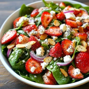 - 4 cups fresh spinach leaves, thoroughly washed and dried - 1 cup ripe strawberries, hulled and thinly sliced - ⅓ cup red onion, finely sliced Fresh produce brings life to this salad. Spinach gives a nice green base. Strawberries add sweetness and a pop of color. I use red onion for a slight bite without being too strong. - ½ cup feta cheese, crumbled into small pieces Feta cheese adds creaminess and a salty flavor. It contrasts well with the sweet strawberries. Crumble it lightly to mix well with the other ingredients. - ¼ cup almonds, either sliced or slivered for added texture - ¼ cup poppy seeds for a delightful crunch Almonds give a nice crunch and healthy fats. You can use sliced or slivered almonds, depending on your preference. Poppy seeds add a fun texture and a light nutty flavor. They also make the dressing really special. {{ingredient_image_2}} Start by grabbing a medium bowl. Add ½ cup of creamy Greek yogurt. Next, pour in 2 tablespoons of pure honey. This will add a nice touch of sweetness. Then, add 2 tablespoons of apple cider vinegar. This gives the dressing a bright flavor. Pour in 1 tablespoon of extra virgin olive oil for a smooth texture. Use a whisk to mix everything together. Keep whisking until the mixture is smooth. Season with fresh salt and cracked black pepper to taste. Finally, fold in ¼ cup of poppy seeds. Let it rest for a few minutes. This helps the flavors blend well. Take a large salad bowl and add 4 cups of fresh spinach leaves. Make sure the spinach is washed and dried well. Then, slice 1 cup of ripe strawberries and add them to the bowl. Next, crumble ½ cup of feta cheese into small pieces and sprinkle it in. Add ¼ cup of sliced or slivered almonds for a nice crunch. Finally, thinly slice ⅓ cup of red onion and toss it in. Gently mix these ingredients to keep the spinach fresh and intact. Drizzle the prepared poppy dressing over the salad. Use enough dressing to coat all the ingredients well. With salad tongs or your hands, gently toss the salad. Make sure every piece of spinach and fruit gets a nice layer of dressing. This creates a tasty blend of flavors that you will love. Now, it’s time to serve! Carefully divide the salad into individual bowls or plates. This makes it look lovely for everyone. For a fun touch, sprinkle a few extra poppy seeds on top of each serving. You can also add a couple of whole strawberries as a cute decoration. Serve the salad chilled for the best taste. To make your salad shine, balance the flavors. The sweet strawberries blend well with the tangy dressing. The creamy feta adds saltiness, while the almonds give a nice crunch. Taste often as you mix. Adjust the honey for sweetness and the vinegar for tang. This helps create a perfect blend that excites the palate. A beautiful salad is a feast for the eyes. Serve your salad in a large bowl or individual plates. Layer the ingredients so each color stands out. Add a few mint leaves or edible flowers for a pop of color. Right before serving, sprinkle more poppy seeds on top. This adds a fun touch and invites guests to dig in. To keep your spinach fresh, wash and dry it well. Store it in a container lined with paper towels. This helps absorb any moisture. Keep it in the fridge, where it can stay crisp. Use it within a few days for the best taste and texture. If you notice wilting, use it in smoothies or soups. Pro Tips Fresh Ingredients Matter: Always use the freshest spinach and strawberries you can find for the best flavor and texture in your salad. Customize Your Nuts: Feel free to substitute almonds with walnuts or pecans for a different taste and texture that complements the salad. Chill for Flavor: Let the assembled salad chill in the refrigerator for about 10 minutes before serving to enhance the flavors and crispness. Make It Ahead: Prepare the dressing in advance and store it in the refrigerator to save time; just toss it with the salad ingredients right before serving. {{image_4}} You can switch out the strawberries for seasonal fruits. Try peaches in summer or apples in fall. Blueberries also add a sweet twist. If you want a crunch, add fresh cucumber or bell pepper. They give a nice crunch and fresh taste to the salad. For a vegan salad, swap the feta cheese for avocado or tofu. Both add creaminess without dairy. Use almond yogurt or coconut yogurt instead of Greek yogurt in the dressing. This keeps the creamy texture while making it dairy-free. Want extra protein? You can add grilled chicken or shrimp on top. Chickpeas or lentils work great too. They will give the salad more texture and heartiness. For a nutty flavor, try adding walnuts or sunflower seeds. Each option makes your salad filling and satisfying. To keep your Strawberry Spinach Salad fresh, store it in the fridge. Use an airtight container. This helps prevent the spinach from wilting. Keep the dressing separate until you are ready to serve. This keeps the salad crisp and tasty. The salad can last up to three days in the fridge. However, the best taste comes within the first two days. The strawberries may become mushy after a couple of days. Always check for freshness before eating. If you want to prep ahead, wash and slice the spinach and strawberries. Store them in the fridge in separate containers. You can make the dressing a day before. Keep it in a sealed jar, allowing the flavors to blend. Just mix everything together right before serving for the best taste. Yes, you can prepare the salad ahead of time. However, I recommend adding the dressing just before serving. This keeps the spinach fresh and crisp. You can wash and slice the strawberries, cheese, and nuts earlier. Store them in airtight containers in the fridge. When you are ready to serve, simply combine everything in a bowl and add the dressing. You have many tasty options for dressings! A balsamic vinaigrette adds a nice tang. A citrus dressing with lemon or orange can brighten the flavors. You can also try a honey mustard dressing for a sweet touch. Each dressing gives a unique twist to the salad. This salad is naturally gluten-free! Just ensure you use gluten-free ingredients. Most dressings are gluten-free, but check labels to be sure. If you add any extras, like granola or croutons, make sure they are gluten-free too. Enjoy this fresh salad without worry! This blog post covered how to make a tasty salad with fresh produce, dairy, nuts, and seeds. I shared easy steps, tips for flavor, and ways to keep ingredients fresh. You can try fun variations to fit your diet and needs. Remember, storage matters too, so follow the guidelines to enjoy your salad longer. Making this dish can be simple and enjoyable. You now have the tools to create your salad masterpiece!